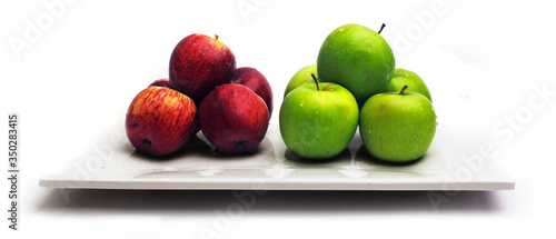 Red and green apples in groups, contrasted bright colors