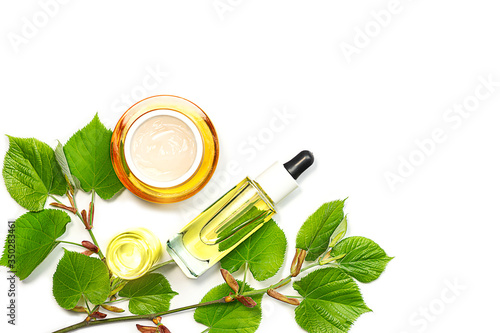 Skin care products, natural cosmetic. Flat lay image on white background Natural cosmetic skincare bottle, serum and organic green leaf. Homemade and beauty product concept.