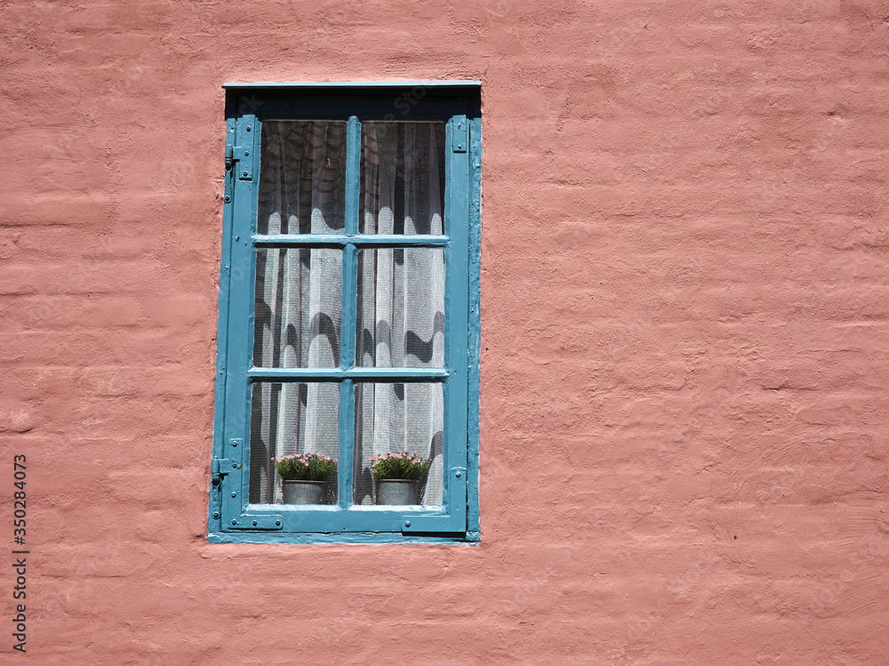 Fototapeta premium Details of a window and painted wall of a traditional style house Denmark