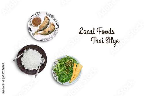 Thai local foods with fried mackerel,boiled vegetable and steamed rice on white color background.