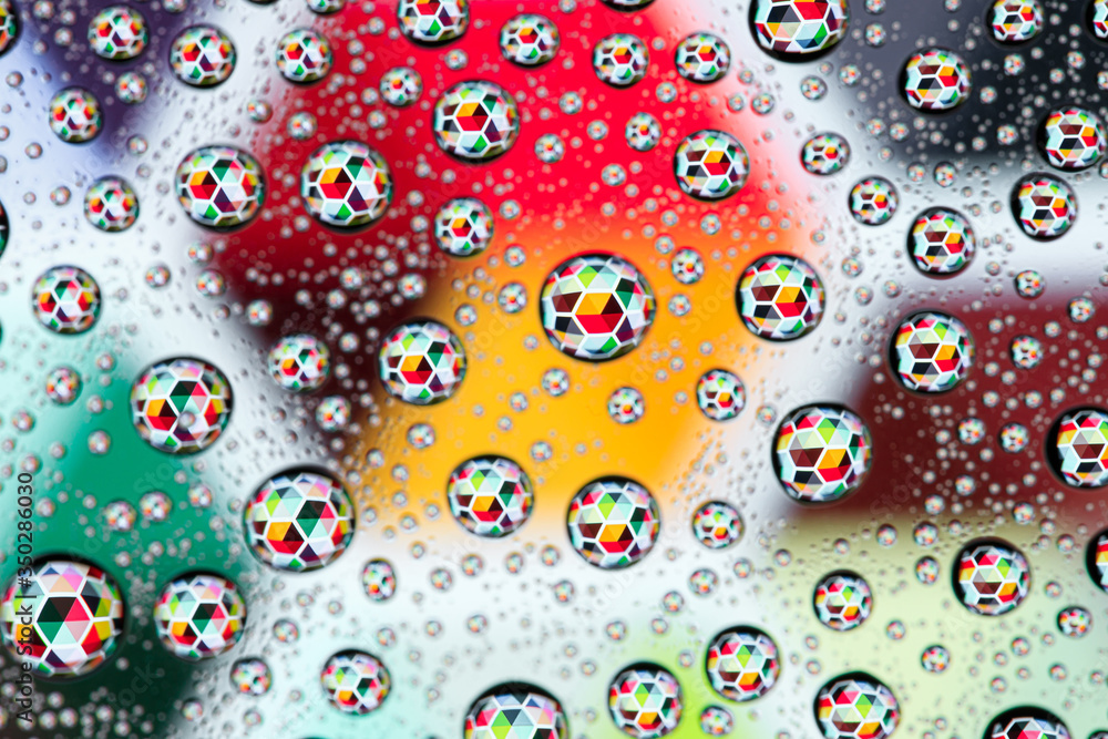 Abstract lines through drops of water on a glass, macro view Abstract lines through drops of water on a glass, macro view