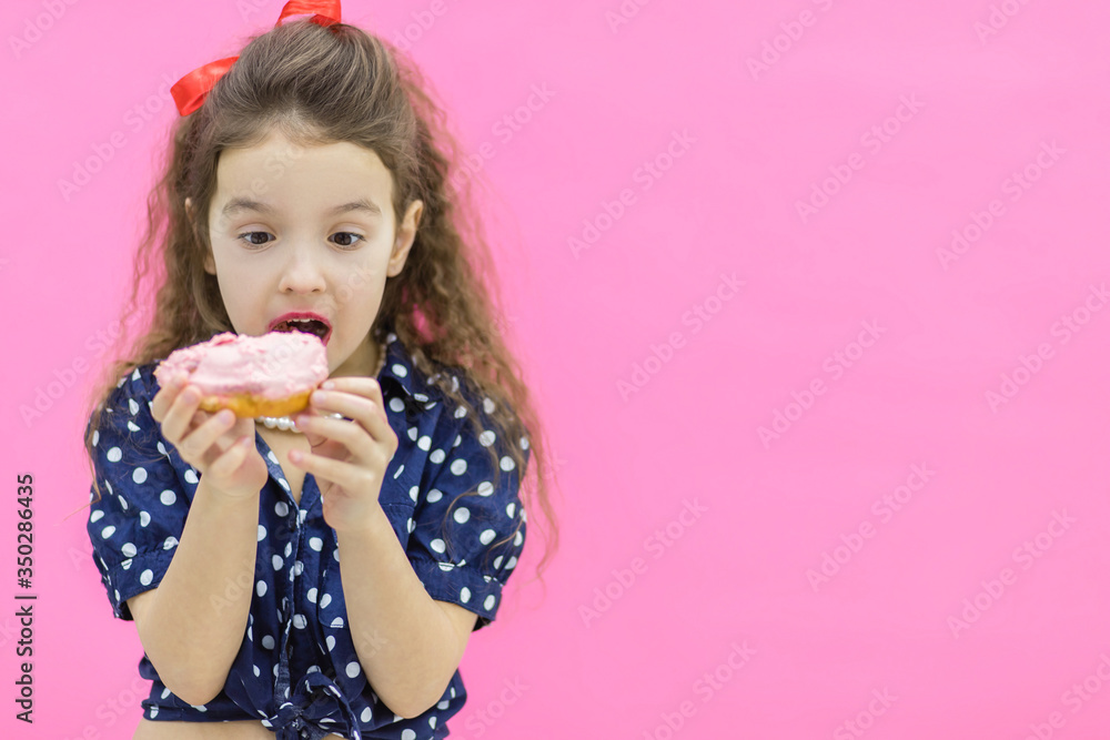 A model holding a glazed donut in hands. A model holding a glazed donut in hands.