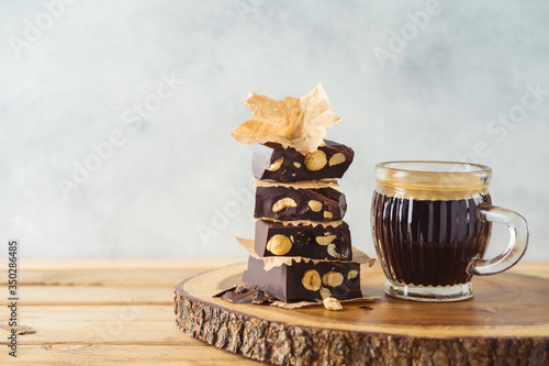 Dark chocolate with coffee cup on wooden table