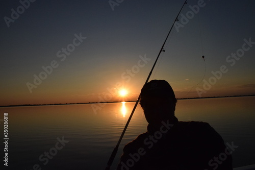 fishing at sunset