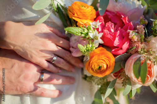 Love couple with rings and bouquet