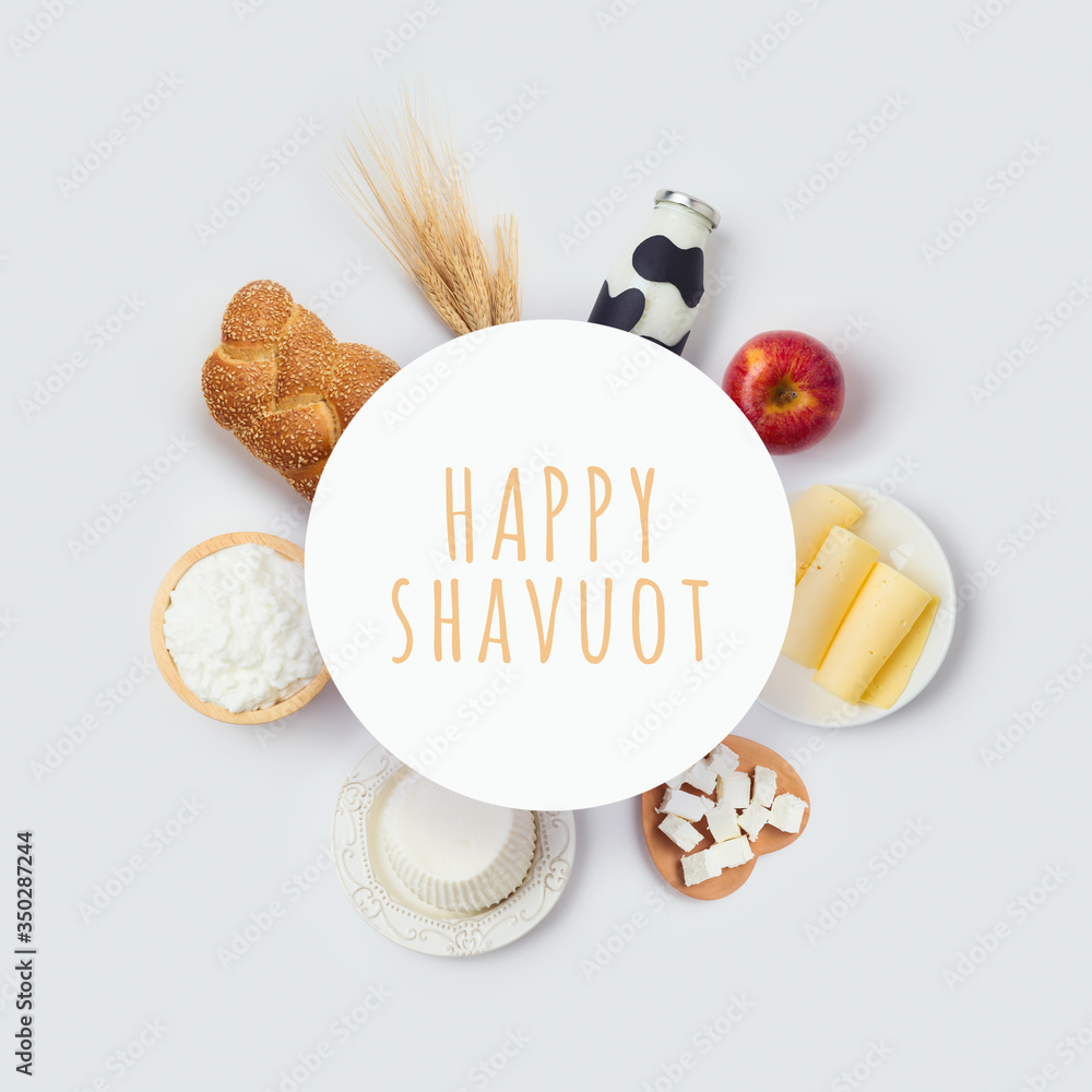 Plakat Jewish holiday Shavuot round banner design with milk bottle, cheese and bread on white background. Top view from above