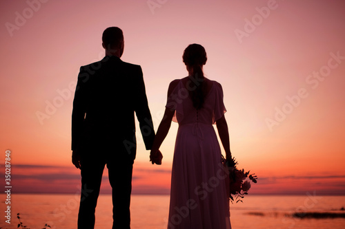 Silhouette of young man and woman