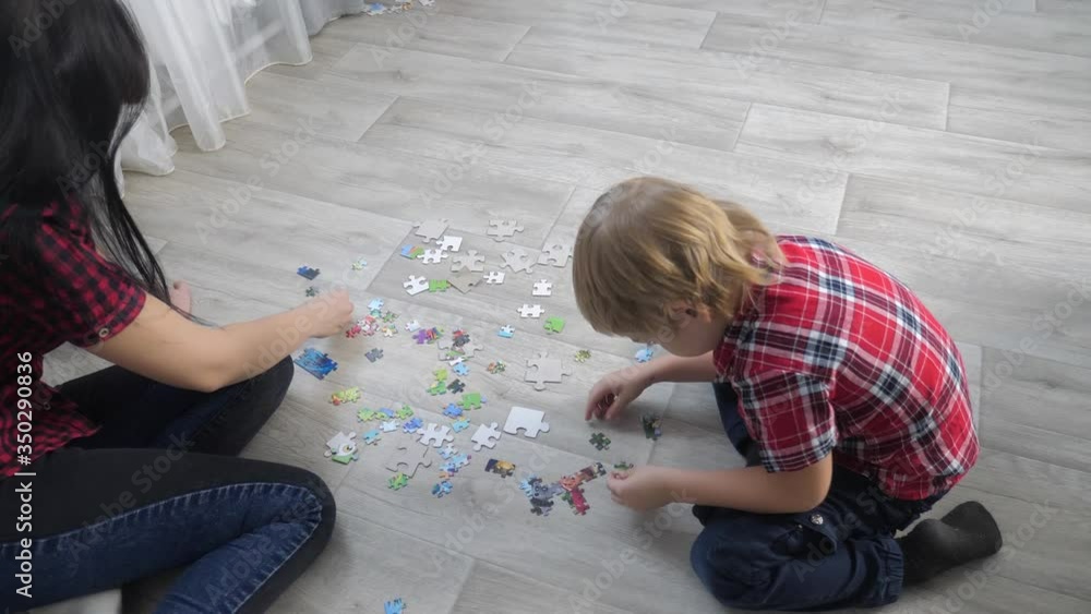 happy family collection puzzles teamwork. development of fine motor skills and thinking. little a son boy lifestyle and girl mom collect mosaic puzzles happy family collection puzzles teamwork. development of fine motor skills and thinking. little a son boy lifestyle and girl mom collect mosaic puzzles