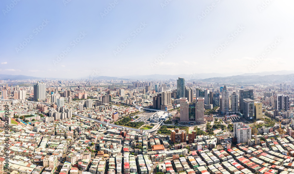 Obraz premium This is a view of the Banqiao district in New Taipei where many new buildings can be seen, the building in the center is Banqiao station, Skyline of New taipei city