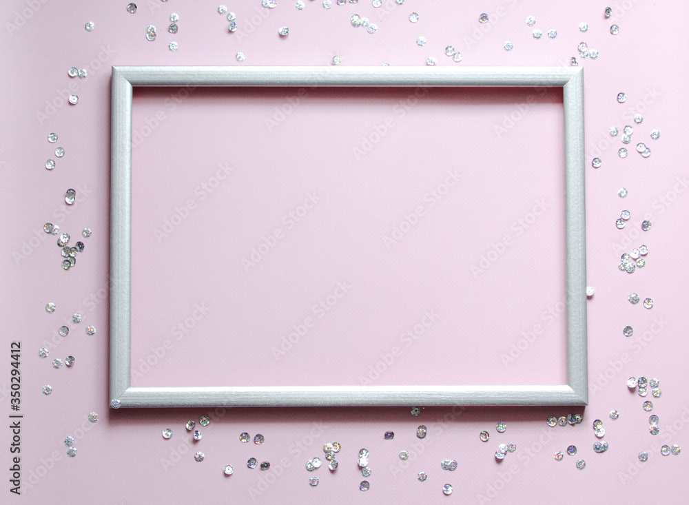 Empty frame silver with the confetti and space for text on pink background. Empty frame silver with the confetti and space for text on pink background.