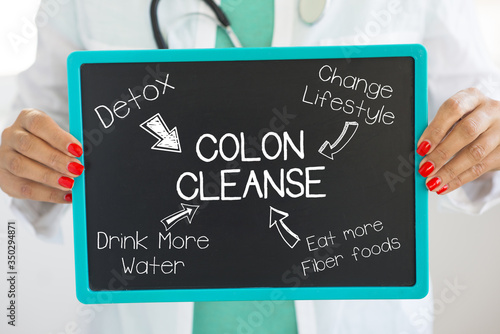 Colon cleanse concept with doctor holding a cardboard with advices how to promote a healthier lifestyle habits