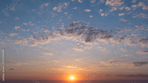 Beautiful sunrise with clouds. © Nadiia