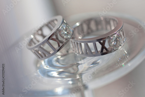 Jeweller ornament. White gold wedding rings