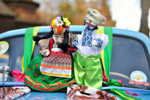 Folk doll. Motanka. Wedding Car Decorations. Ukrainian doll-motanka or rag doll. Handmade textile doll ancient culture folk crafts tradition of Ukraine. Yarn. 