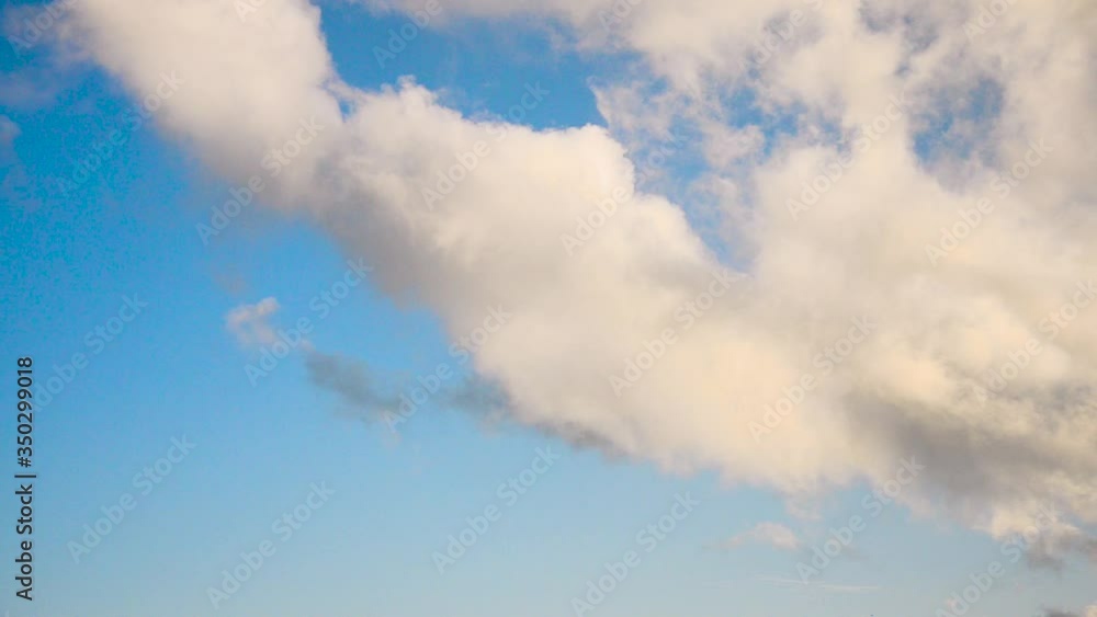 Broken white cumulus stratus clouds after a rain on a background of blue sky timelapse Broken white cumulus stratus clouds after a rain on a background of blue sky timelapse