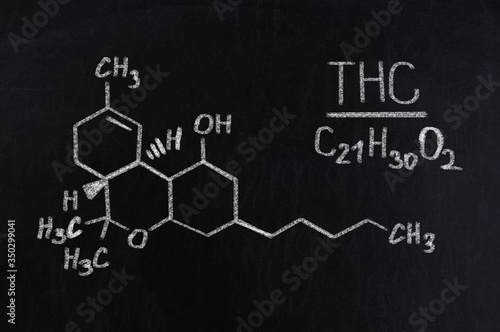Black chalkboard with the chemical formula of THC
