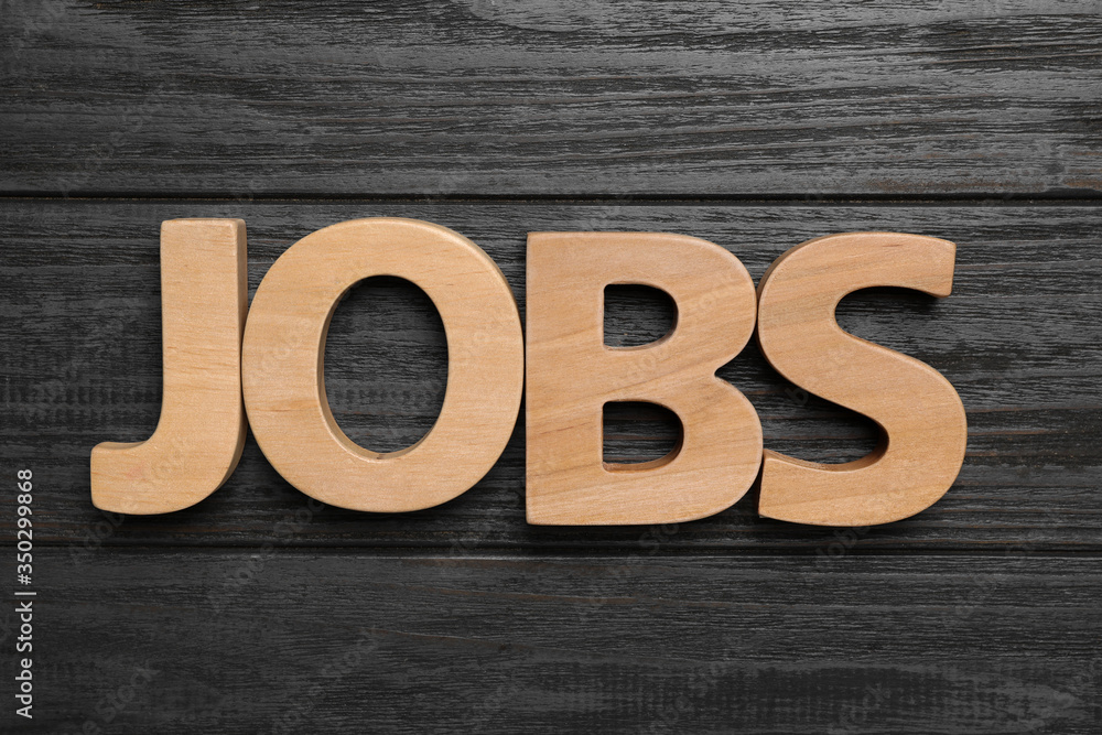 Word JOBS on wooden background, flat lay. Career concept Word JOBS on wooden background, flat lay. Career concept