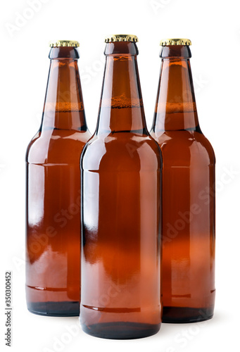 Beer in glass bottles close-up on a white. Isolated