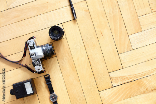 Old type photographic equipment on wooden floor