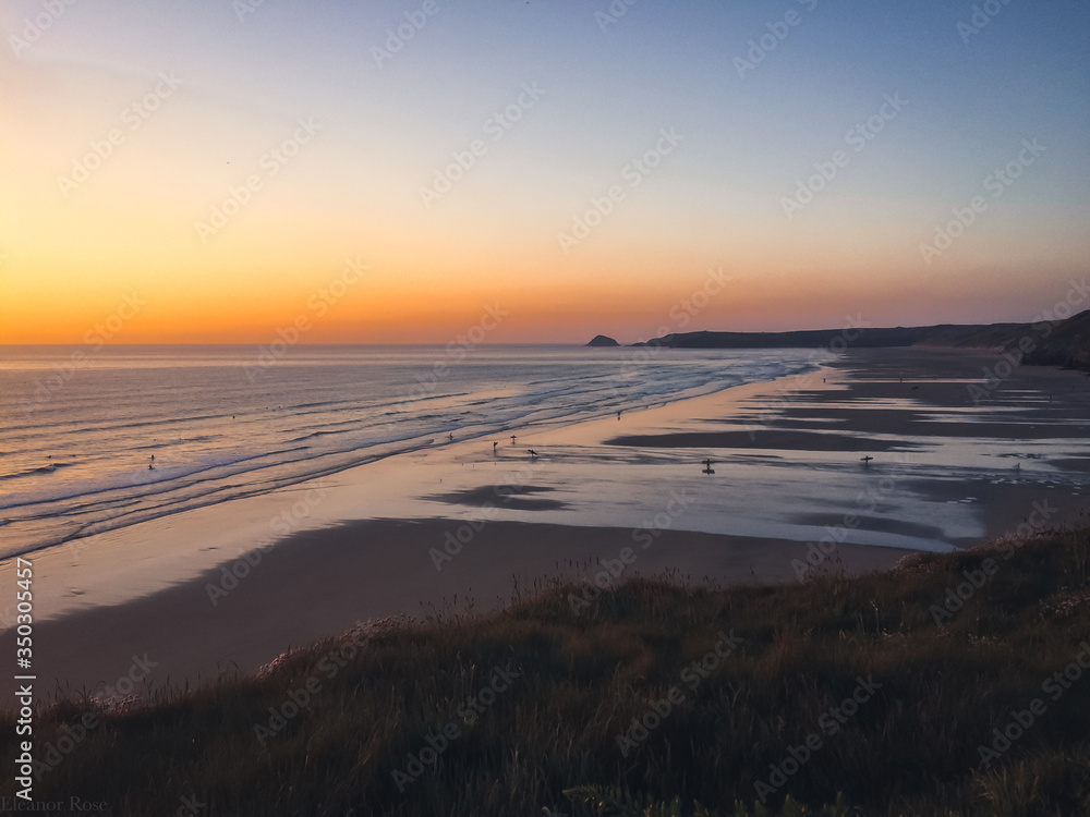 Fototapeta premium Surfers at Sunset