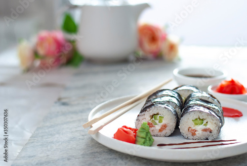 Sushi Rolls asian food stylish beautiful close up picture. Tasty delishes meals with rice and seafood on the white plate