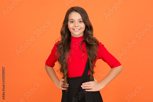 Welcome school in style. Happy child smile brown background. School uniform style. Back to school. Fashion and style. Fashion look of beauty model. Beauty and look. Her look is always in style © be free