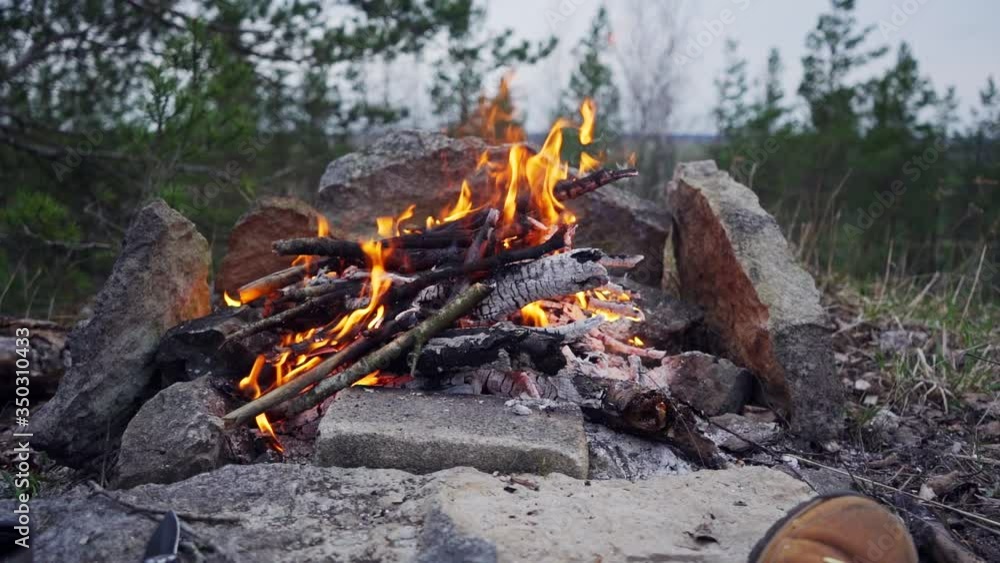 A man sits in front of a bonfire in the mountains with a cup of hot tea. Sitting in front of a campfire in the mountains.
Barbecue on the nature in the mountains.
Slow motion footage. A man sits in front of a bonfire in the mountains with a cup of hot tea. Sitting in front of a campfire in the mountains.
Barbecue on the nature in the mountains.
Slow motion footage.