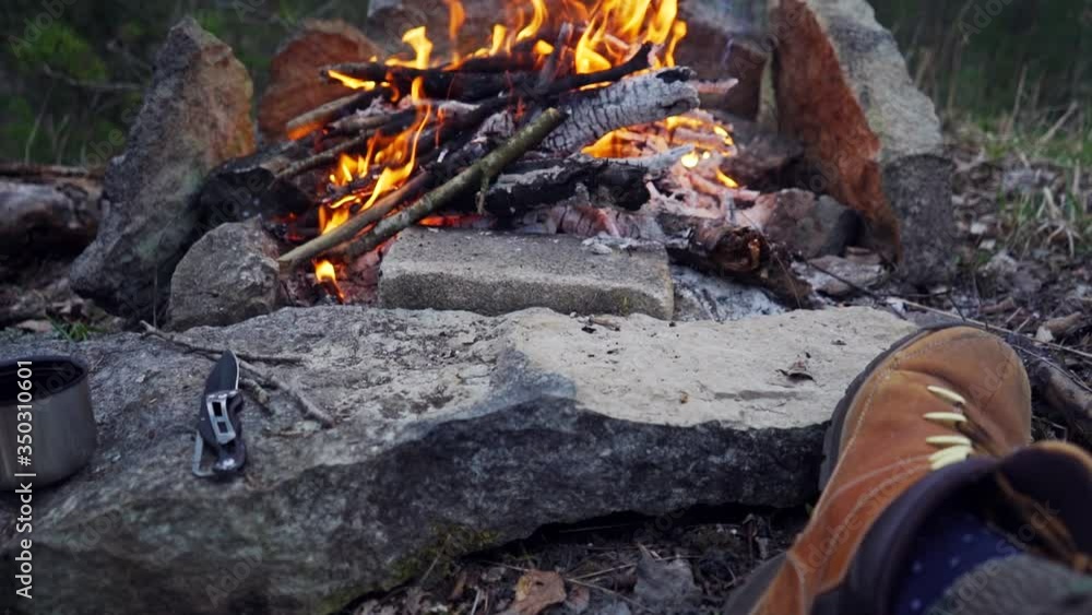 A man sits in front of a bonfire in the mountains with a cup of hot tea. Sitting in front of a campfire in the mountains.
Barbecue on the nature in the mountains.
Slow motion footage. A man sits in front of a bonfire in the mountains with a cup of hot tea. Sitting in front of a campfire in the mountains.
Barbecue on the nature in the mountains.
Slow motion footage.