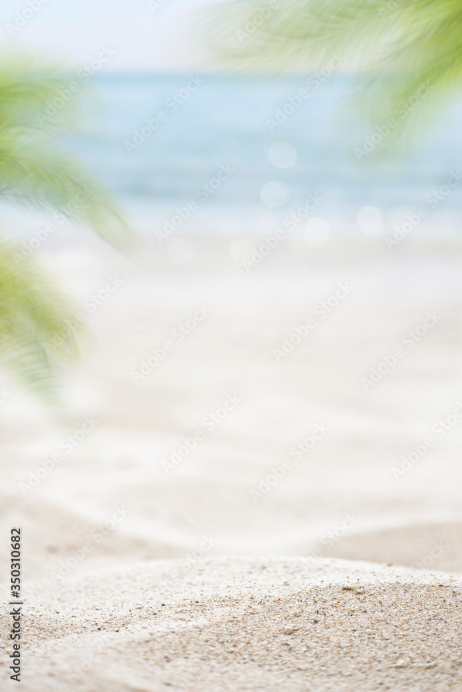blurred of the sea and sand in the summer for abstract background