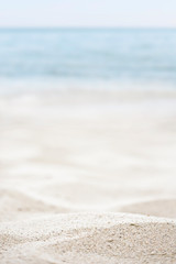 blurred of the sea and sand in the summer for abstract background