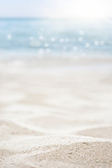 blurred of the sea and sand in the summer for abstract background
