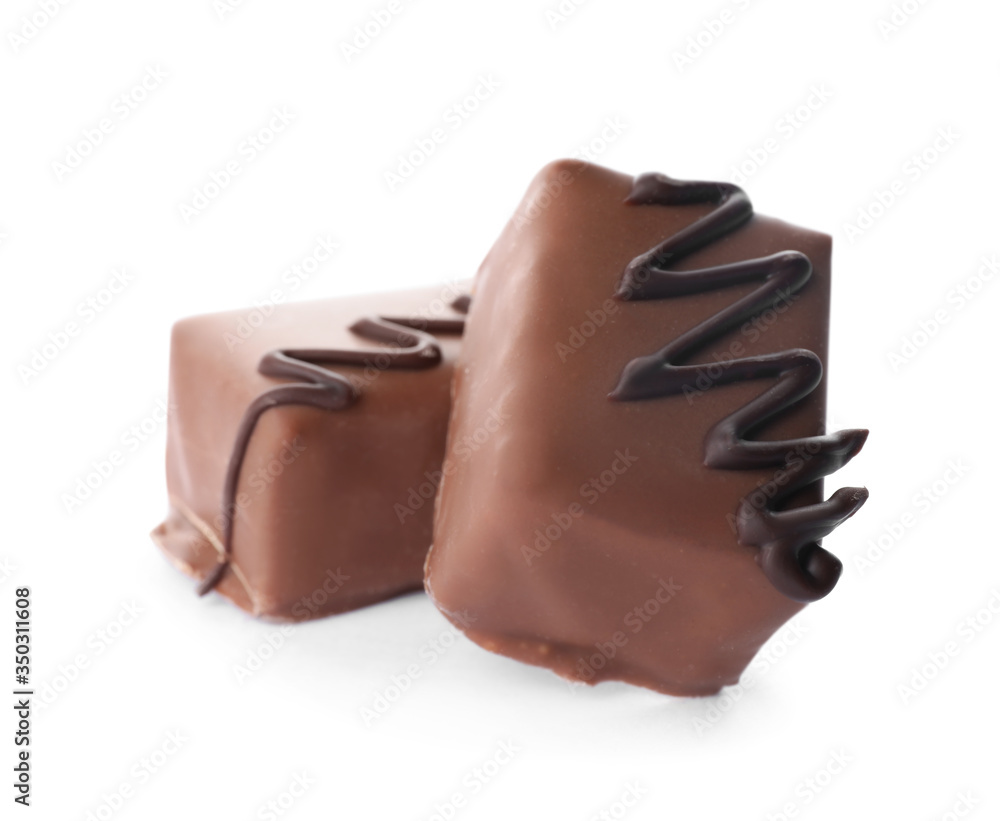 Delicious milk chocolate candies isolated on white Delicious milk chocolate candies isolated on white
