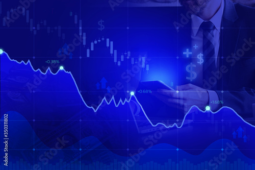 stock market on blue color and hand mobile.