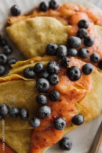 Pancakes with berries close-up.