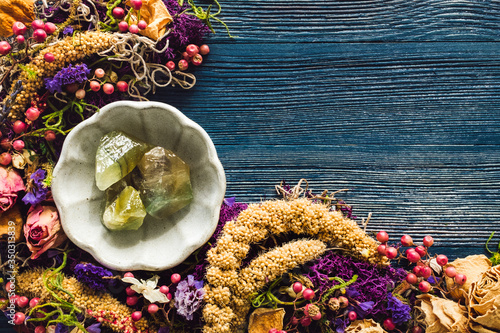 Canvastavla Green Calcite with Dried Flowers and Moss on Blue Background