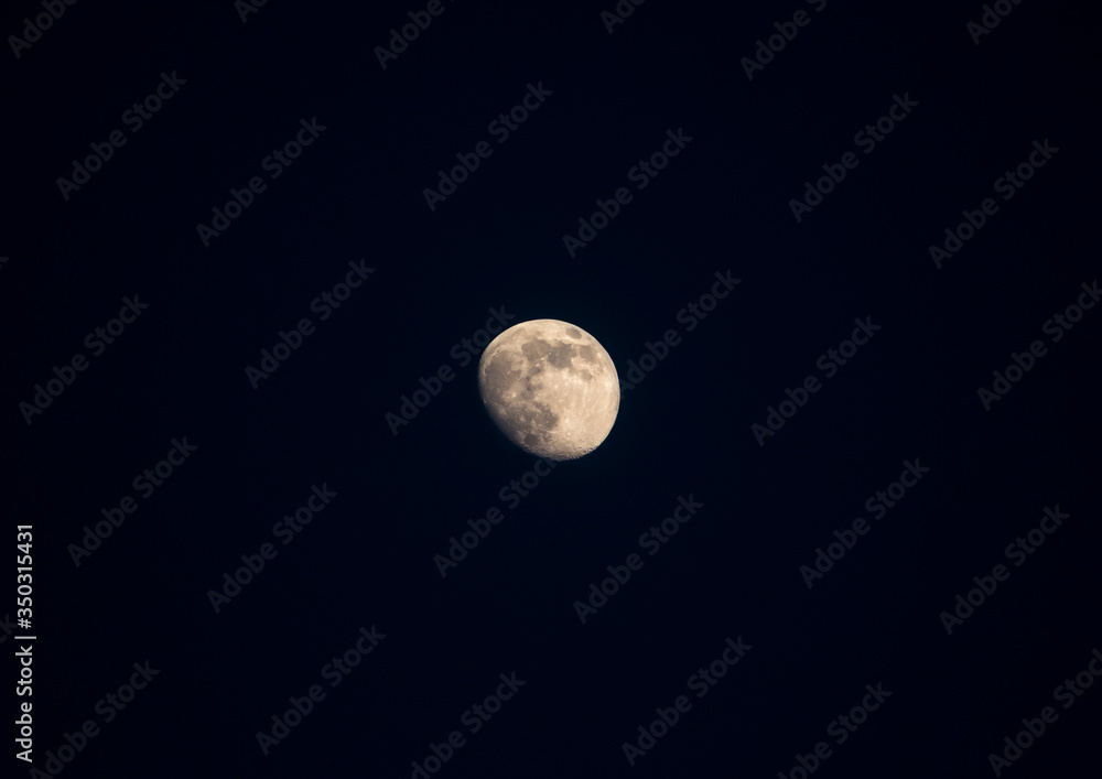 satellite of the earth, the moon in the dark night sky satellite of the earth, the moon in the dark night sky