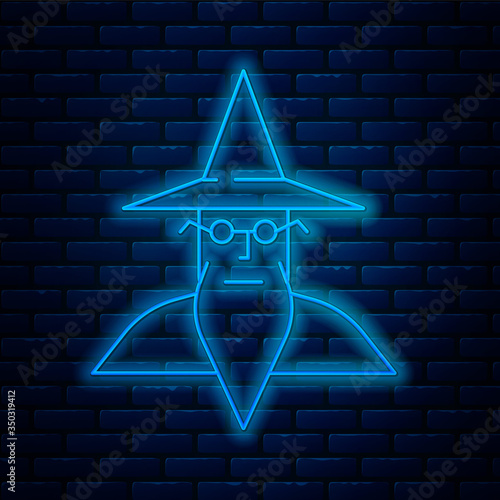 Glowing neon line Wizard warlock icon isolated on brick wall background. Vector Illustration