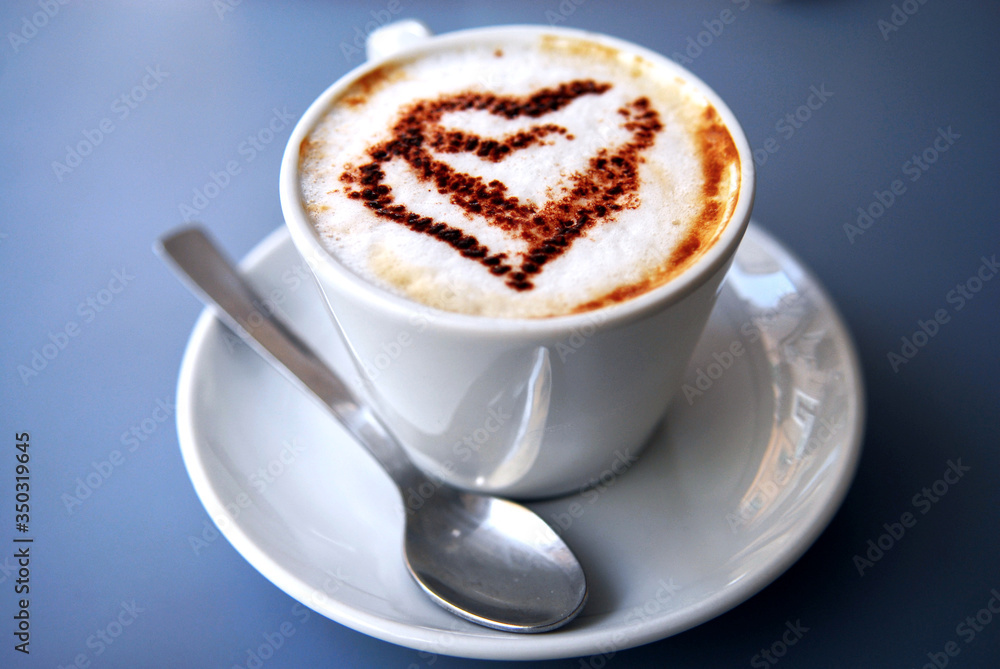 Nice closeup cup of coffee with hearts on coffee foam. Coffee break in syle. Luxury relaxing lifestyle. Nice closeup cup of coffee with hearts on coffee foam. Coffee break in syle. Luxury relaxing lifestyle.