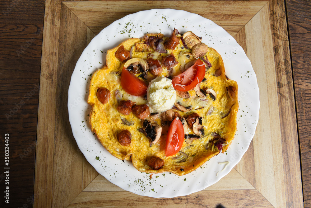 Omelet with sausages and vegetables Omelet with sausages and vegetables