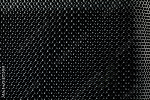 Wallpaper Mural Metallic background with perforation of round holes. Black metal texture with round holes Torontodigital.ca