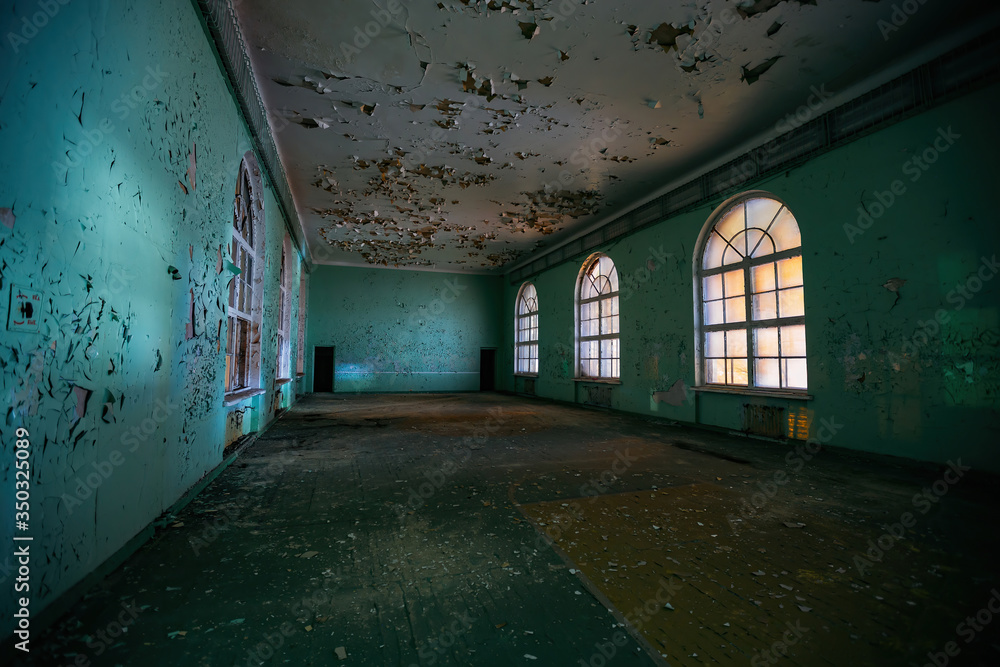 Large empty hall inside old abandoned building