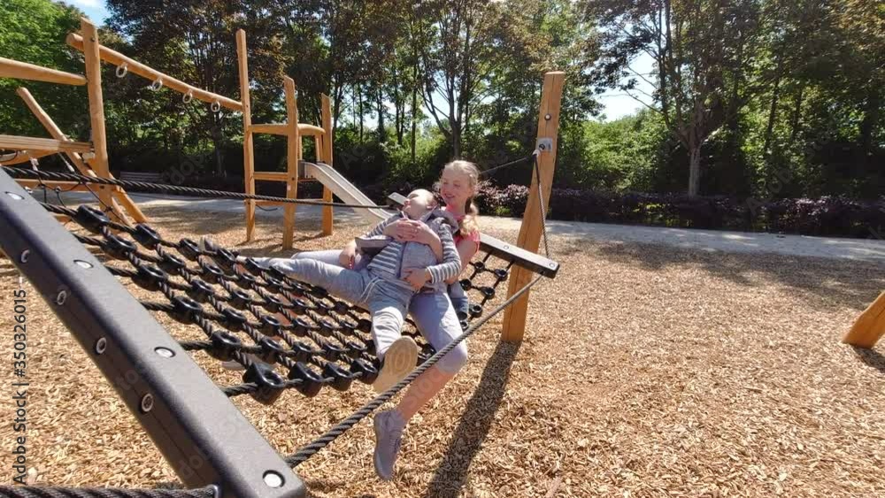 Happy children playing and having fun at playground. Cute children having fun on a play ground Happy children playing and having fun at playground. Cute children having fun on a play ground