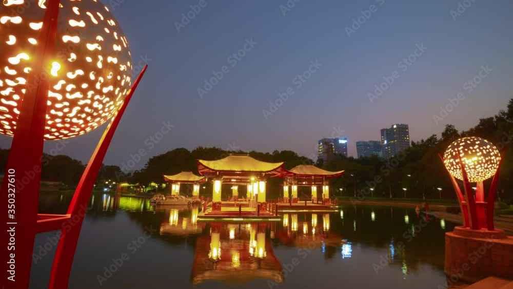sunset time illumination foshan city famous lakeside park square pagoda