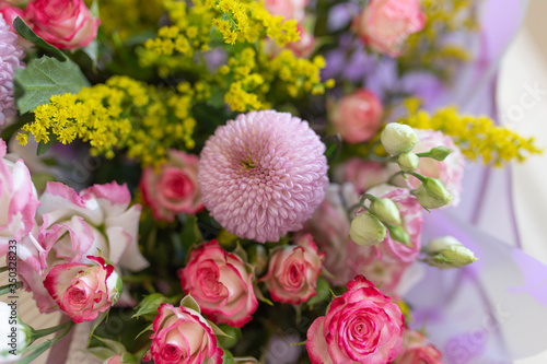 A nice bouquet of fresh flowers  Colors  Lilac  yellow  pink. Flowers  rose  chrysanthemum  snapdragons  eustoma 