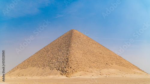 The Bent Pyramid is an ancient Egyptian pyramid located at the royal necropolis of Dahshur  approximately 40 kilometres south of Cairo  built under the Old Kingdom Pharaoh Sneferu. Egypt