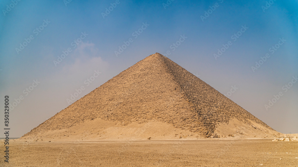 The Bent Pyramid is an ancient Egyptian pyramid located at the royal necropolis of Dahshur, approximately 40 kilometres south of Cairo, built under the Old Kingdom Pharaoh Sneferu. Egypt The Bent Pyramid is an ancient Egyptian pyramid located at the royal necropolis of Dahshur, approximately 40 kilometres south of Cairo, built under the Old Kingdom Pharaoh Sneferu. Egypt