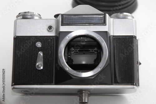 Retro SLR camera front panel with mechanical timer, light meter sensor and lens mount with shutter mirror inside