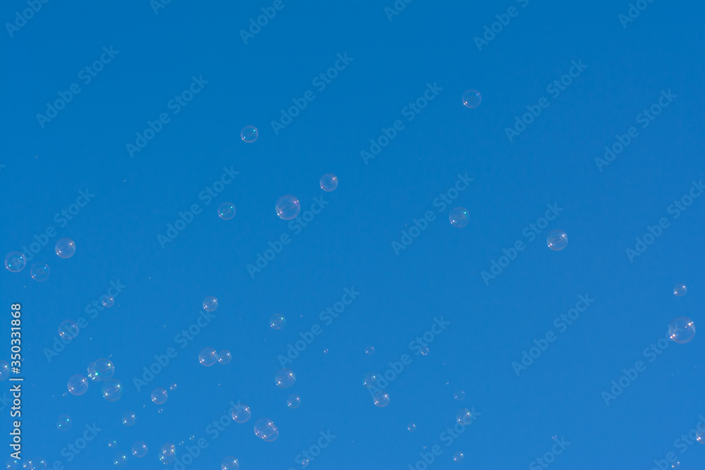 Natural soap bubbles in blue skies