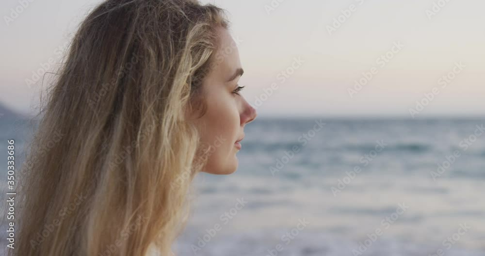 Caucasian woman enjoying her time seaside Caucasian woman enjoying her time seaside