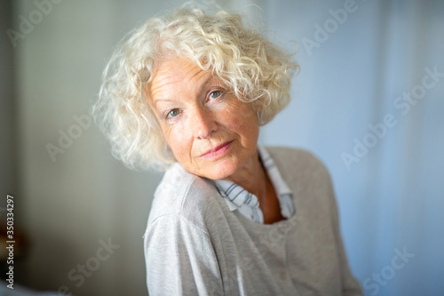 Close up beautiful older woman staring